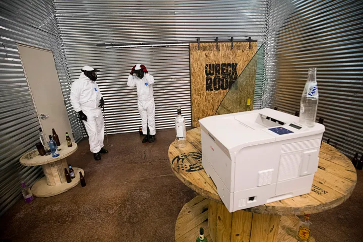 Ryan Slattery, left, and Reimon Bollozos suit up for destruction in a Wreck Room
